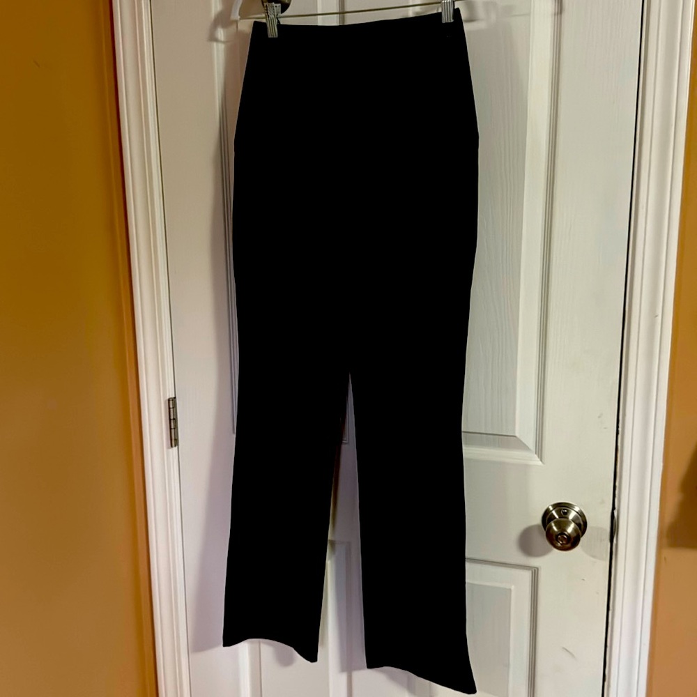 Black, lululemon dress style pants. Size 4. Two side zipper pockets.